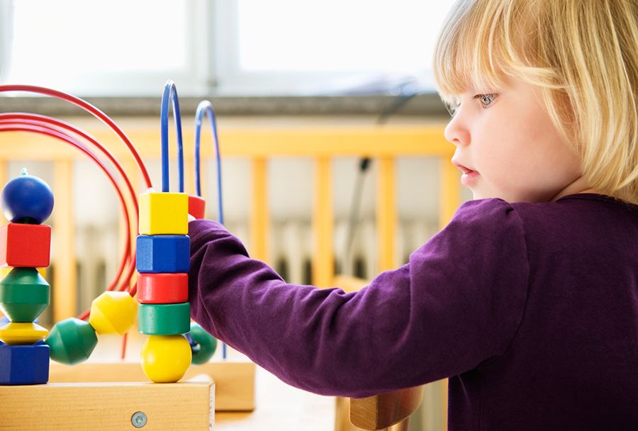 little girl playing at daycare