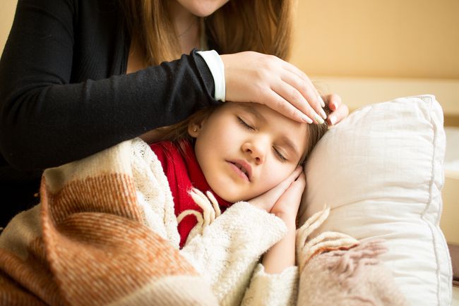 Soothing Sick Kids Girl Laying With Mother