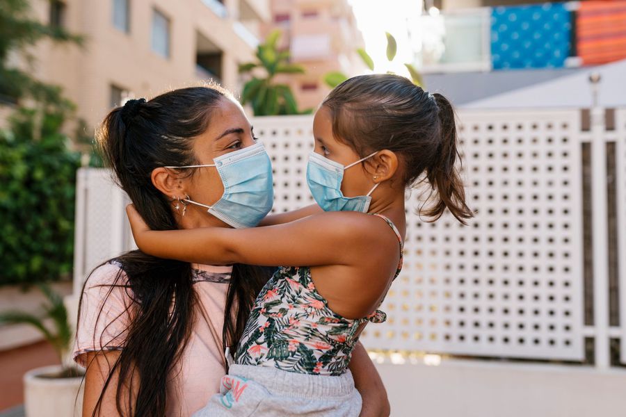 An image of a mother holding her daughter.