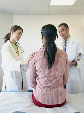 woman talking to doctors