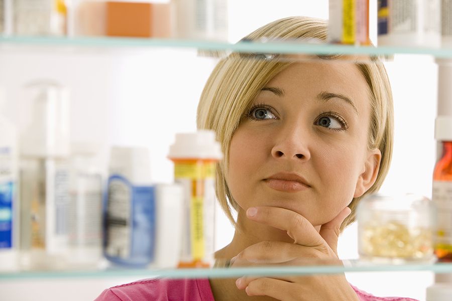 Women looking into medicine cabinet