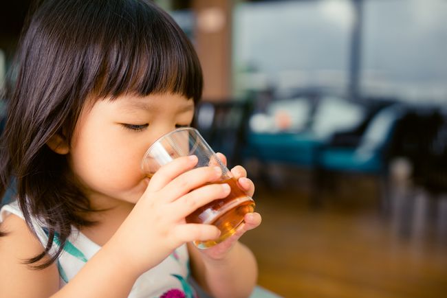 girl drinking apple juice