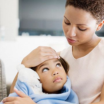 Mother holding sick child