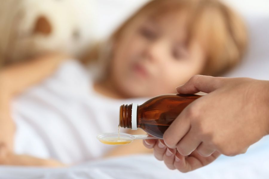 pouring cough syrup with codeine for child