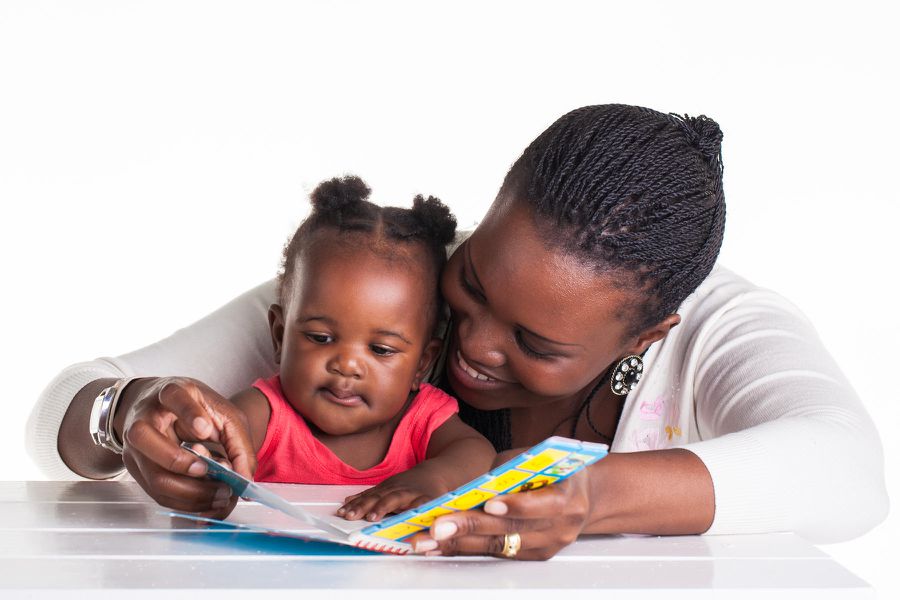 mom reading to baby