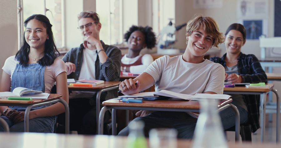 Shot of students laughing during a lesson in a classroom