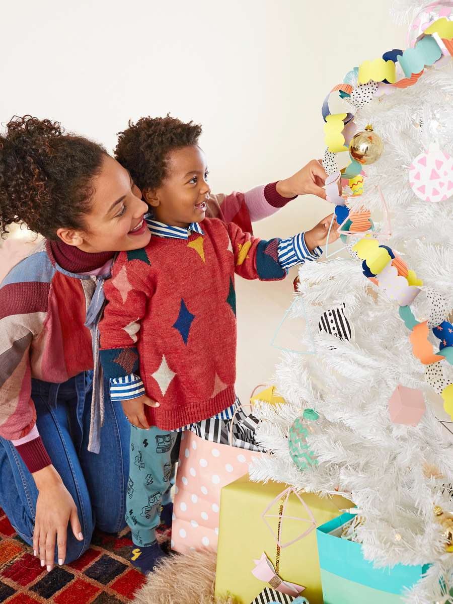 mom and child decorating tree