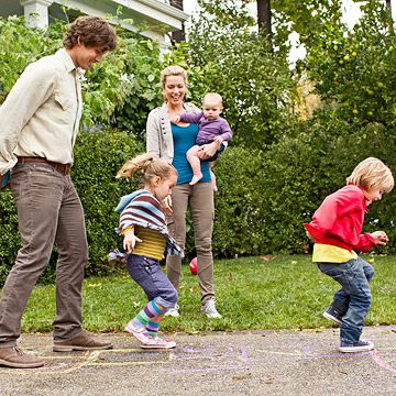 family playing hopscotch