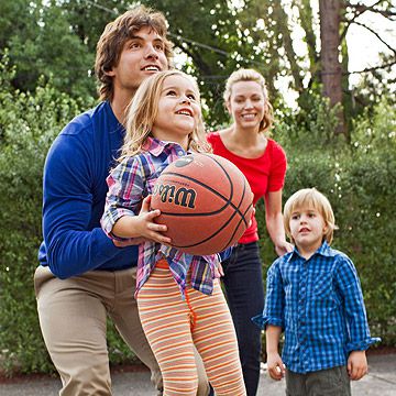 family playing basketball