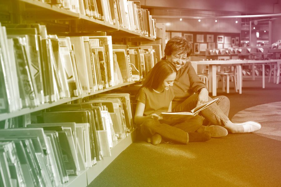 mother and daughter in library