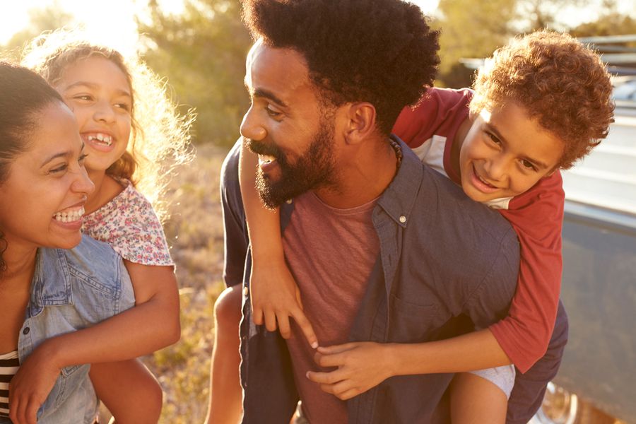 Family Kindness Challenge Children on Parents Back