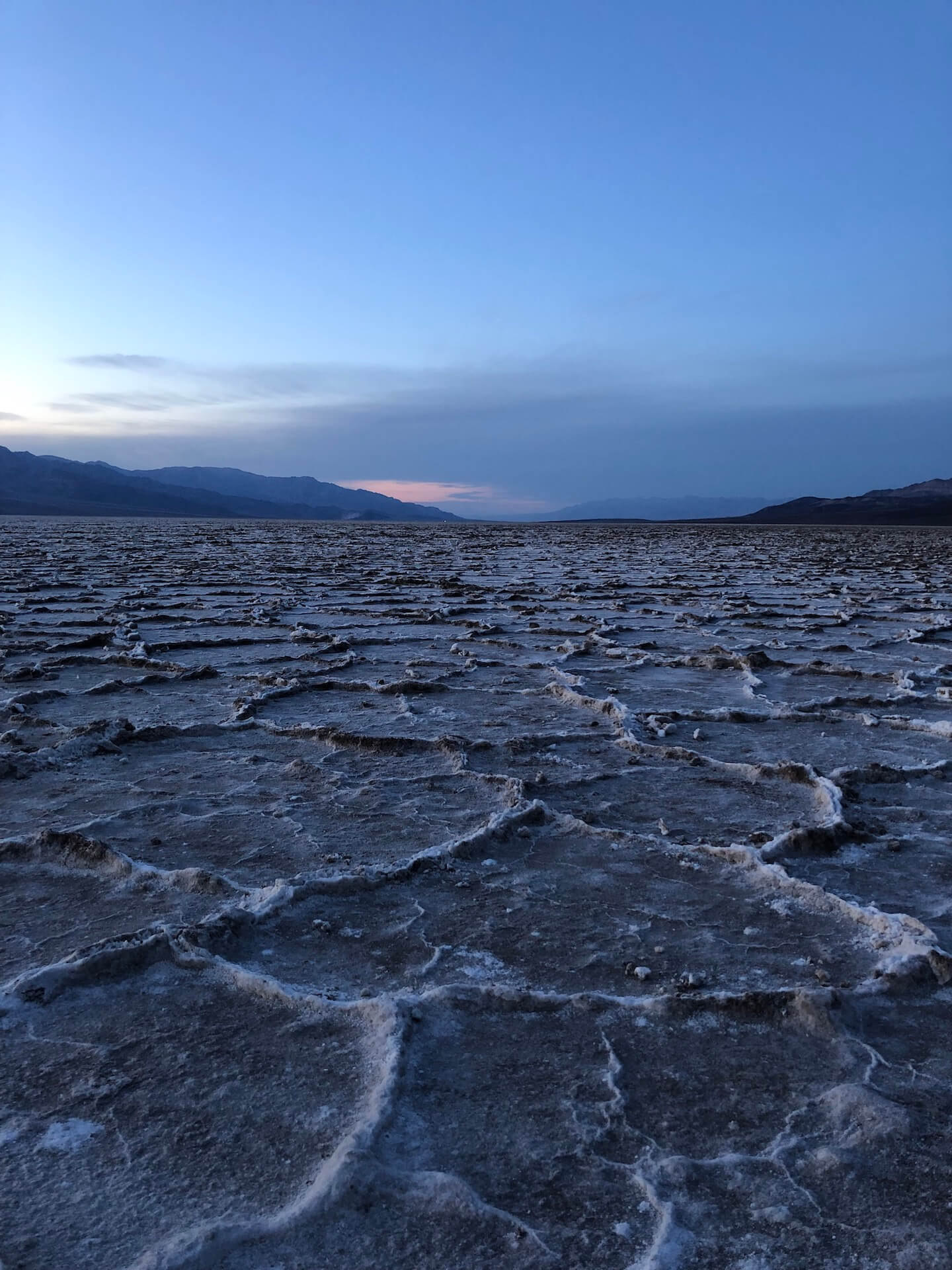 A dark, lunar-looking landscape