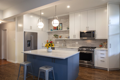 Vintage inspired condo kitchen with hanging globe-shapped lights.