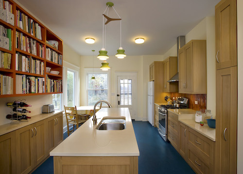 Row house kitchen with three layers of lighting.