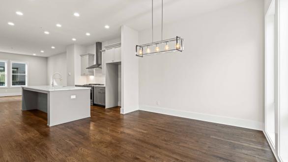 An empty dining room and kitchen