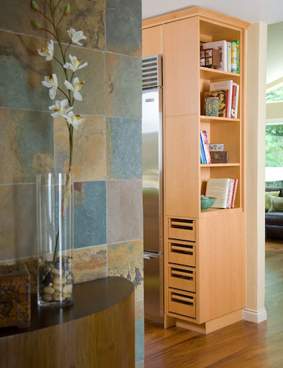 Bookcase on top with onion and potato storage below.