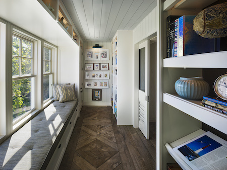 Extra storage above and below windows with creative use of shelving.