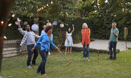 Backyard game of croquet between friends