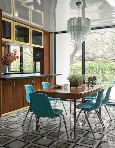 Kitchen with a mix of cabinets and metallic accents